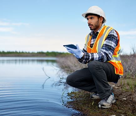 worker testing water contamination levels